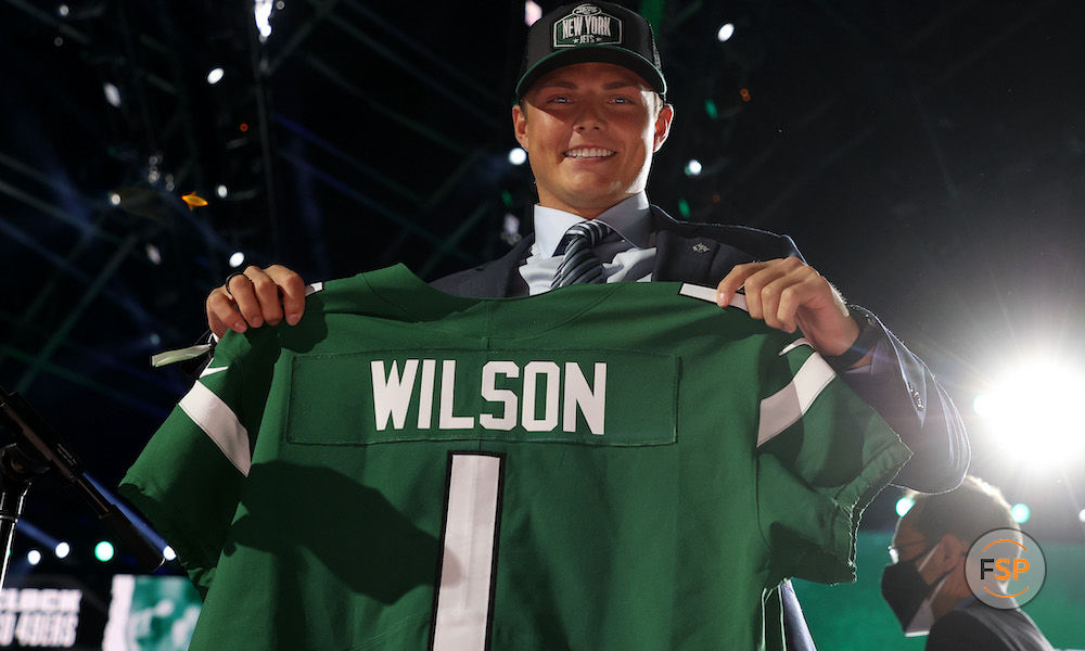 CLEVELAND, OHIO - APRIL 29: Zach Wilson holds a jersey onstage after being drafted second by the New York Jets during round one of the 2021 NFL Draft at the Great Lakes Science Center on April 29, 2021 in Cleveland, Ohio. (Photo by Gregory Shamus/Getty Images)