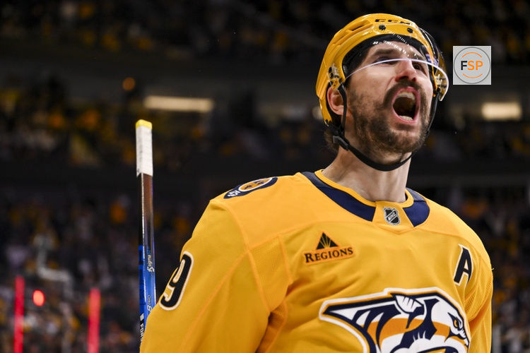 Feb 2, 2026; Nashville, Tennessee, USA;  Nashville Predators left wing Filip Forsberg (9) celebrates his goal against the St. Louis Blues during the second period at Bridgestone Arena. Credit: Steve Roberts-Imagn Images