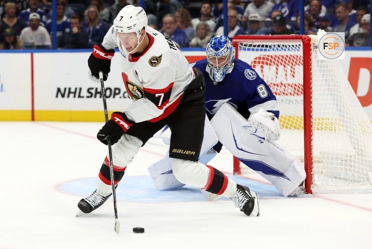 Oct 9, 2025; Tampa, Florida, USA; Ottawa Senators left wing Brady Tkachuk (7) skates with the puck in front of Tampa Bay Lightning goaltender Andrei Vasilevskiy (88) during the second period at Benchmark International Arena. Credit: Kim Klement Neitzel-Imagn Images