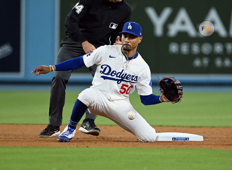 LOS ANGELES, CA - JUNE 12: Los Angeles Dodgers shortstop Mookie Betts (50) fielding a throw from catcher during an MLB baseball game played on June 12, 2024 at Dodger Stadium in Los Angeles, CA. (Photo by John Cordes/Icon Sportswire)