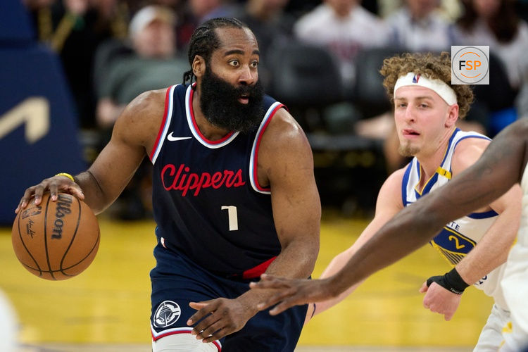 Apr 13, 2025; San Francisco, California, USA; LA Clippers guard James Harden (1) controls the ball against Golden State Warriors guard Brandin Podziemski (2) during the third quarter at Chase Center. Credit: Robert Edwards-Imagn Images