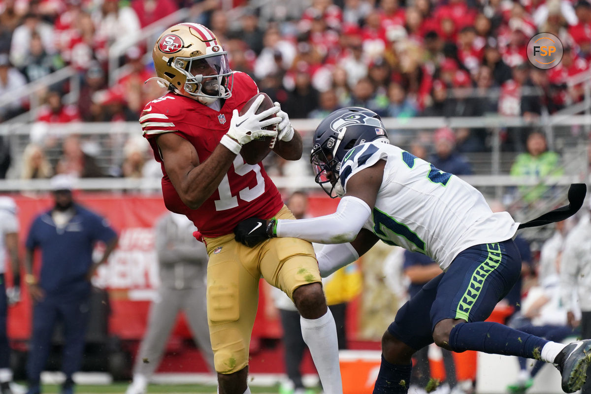 Nov 17, 2024; Santa Clara, California, USA; San Francisco 49ers wide receiver Jauan Jennings (15) makes a reception while defended by Seattle Seahawks cornerback Riq Woolen (27) in the third quarter at Levi's Stadium. Credit: David Gonzales-Imagn Images