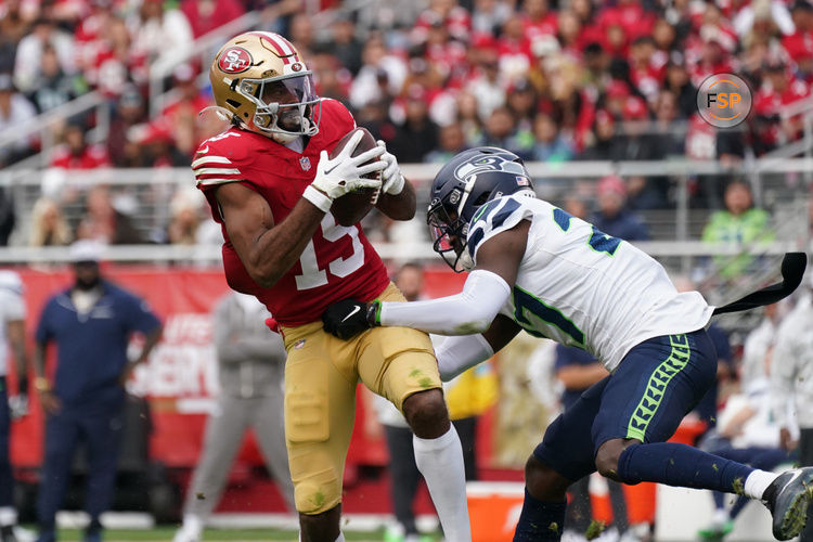 Nov 17, 2024; Santa Clara, California, USA; San Francisco 49ers wide receiver Jauan Jennings (15) makes a reception while defended by Seattle Seahawks cornerback Riq Woolen (27) in the third quarter at Levi's Stadium. Credit: David Gonzales-Imagn Images