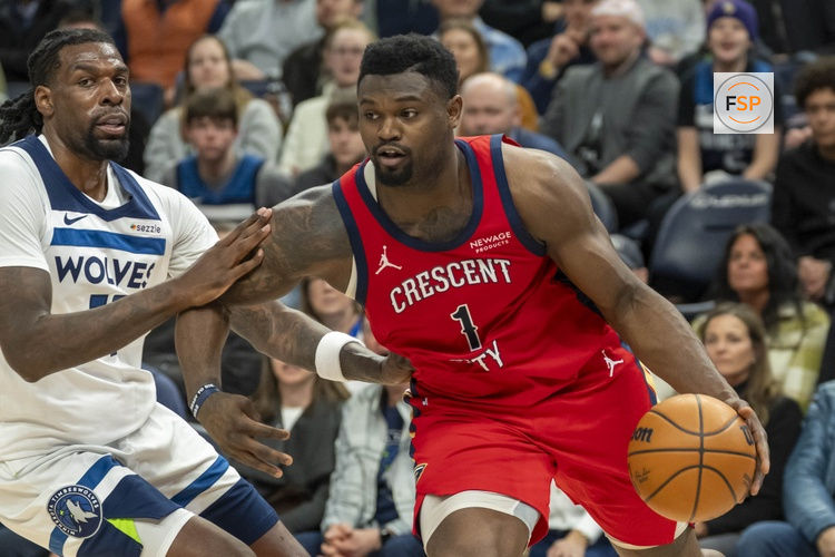 Mar 19, 2025; Minneapolis, Minnesota, USA; New Orleans Pelicans forward Zion Williamson (1) drives to the basket past Minnesota Timberwolves center Naz Reid (11) in the second half at Target Center. Credit: Jesse Johnson-Imagn Images