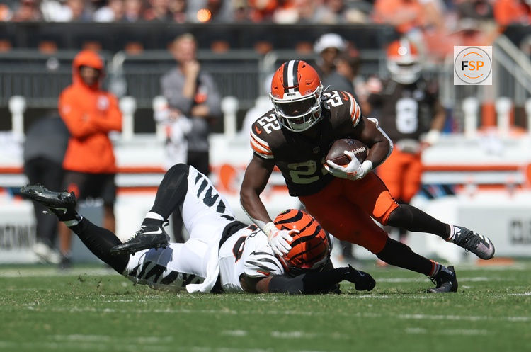 Sep 7, 2025; Cleveland, Ohio, USA; Cleveland Browns running back Dylan Sampson (22) runs against Cincinnati Bengals linebacker Barrett Carter (49) during the second half at Huntington Bank Field. Credit: Scott Galvin-Imagn Images