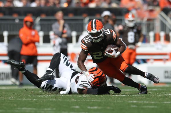 Sep 7, 2025; Cleveland, Ohio, USA; Cleveland Browns running back Dylan Sampson (22) runs against Cincinnati Bengals linebacker Barrett Carter (49) during the second half at Huntington Bank Field. Mandatory Credit: Scott Galvin-Imagn Images