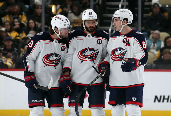 Jan 7, 2025; Pittsburgh, Pennsylvania, USA; Columbus Blue Jackets center Adam Fantilli (19) and right wing Kirill Marchenko (86) and defenseman Zach Werenski (8) talk before the start of the overtime period against the Pittsburgh Penguins at PPG Paints Arena. Mandatory Credit: Charles LeClaire-Imagn Images