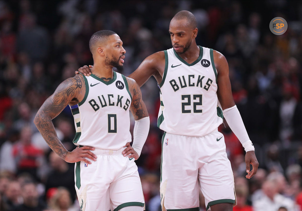 CHICAGO, IL - NOVEMBER 30: Khris Middleton #22 of the Milwaukee Bucks chats with Damian Lillard #0 of the Milwaukee Bucks during the second half against the Chicago Bulls at the United Center on November 30, 2023 in Chicago, Illinois. (Photo by Melissa Tamez/Icon Sportswire)