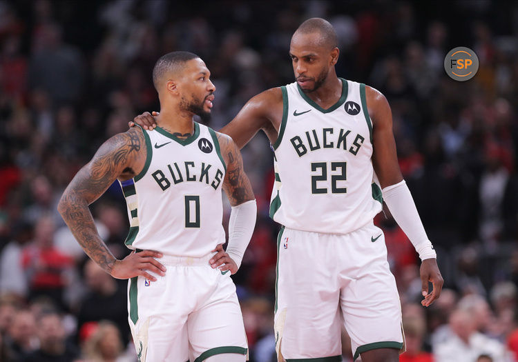 CHICAGO, IL - NOVEMBER 30: Khris Middleton #22 of the Milwaukee Bucks chats with Damian Lillard #0 of the Milwaukee Bucks during the second half against the Chicago Bulls at the United Center on November 30, 2023 in Chicago, Illinois. (Photo by Melissa Tamez/Icon Sportswire)