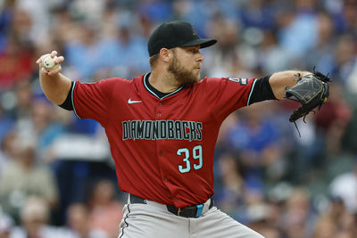 Apr 18, 2025; Chicago, Illinois, USA; Arizona Diamondbacks starting pitcher Corbin Burnes (39) delivers a pitch against the Chicago Cubs during the first inning at Wrigley Field. Mandatory Credit: Kamil Krzaczynski-Imagn Images