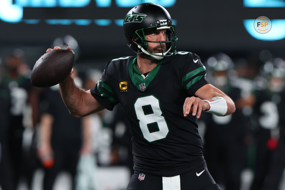 Oct 31, 2024; East Rutherford, New Jersey, USA; New York Jets quarterback Aaron Rodgers (8) throws a pass against the Houston Texans during the first half at MetLife Stadium. Credit: Ed Mulholland-Imagn Images