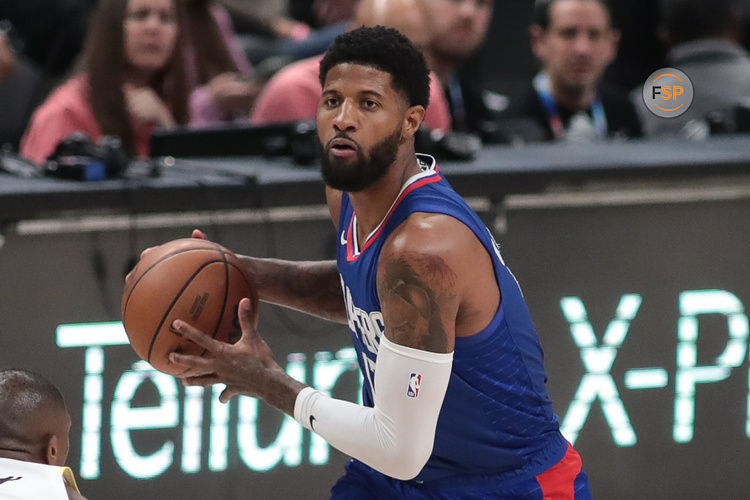 LOS ANGELES, CA - APRIL 5: LA Clippers forward Paul George (13) holds the ball  during the Utah Jazz vs LA Clippers game on April 05, 2024, at Crypto.com Arena in Los Angeles, CA.  (Photo by Jevone Moore/Icon Sportswire)