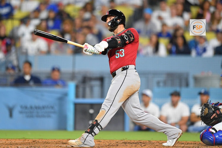 LOS ANGELES, CA - JULY 03: Arizona Diamondbacks first baseman Christian Walker (53) watches his home run during the MLB game between the Arizona Diamondbacks and the Los Angeles Dodgers on July 3, 2024 at Dodger Stadium in Los Angeles, CA. (Photo by Brian Rothmuller/Icon Sportswire)