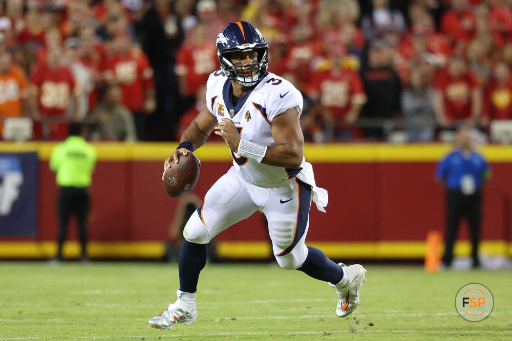 KANSAS CITY, MO - OCTOBER 12: Denver Broncos quarterback Russell Wilson (3) rolls out in the first quarter of an AFC West matchup between the Denver Broncos and Kansas City Chiefs on Oct 12, 2023 at GEHA Field at Arrowhead Stadium in Kansas City, MO.  (Photo by Scott Winters/Icon Sportswire)