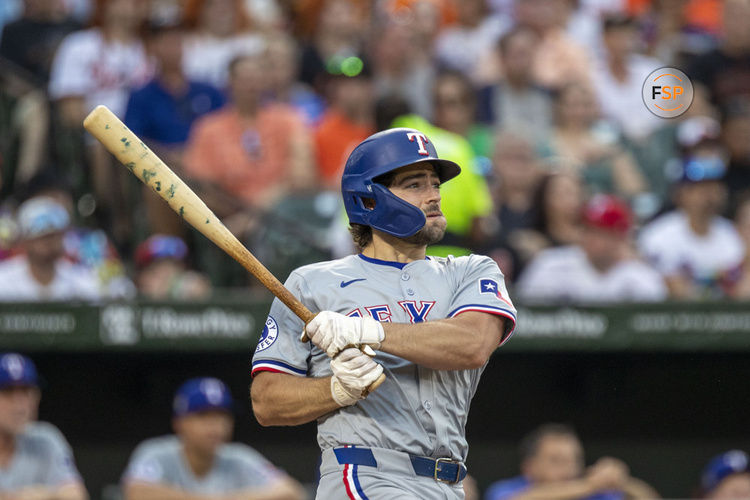 BALTIMORE, MD - JUNE 29: Texas Rangers third base Josh Smith (8) watches a ball he hit during the Texas Rangers versus Baltimore Orioles MLB game at Orioles Park at Camden Yards on June 29, 2024, in Baltimore, MD. (Photo by Charles Brock/Icon Sportswire)