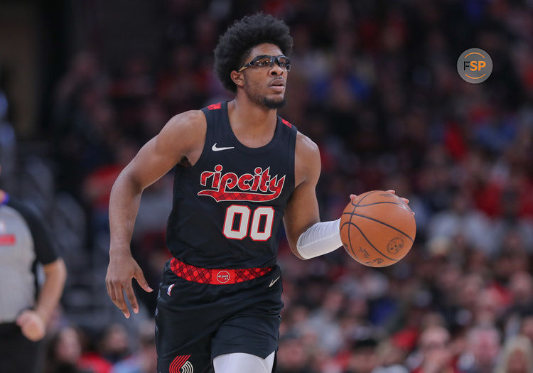 CHICAGO, IL - MARCH 18: Scoot Henderson #00 of the Portland Trail Blazers brings the ball up court during the first half against the Chicago Bulls at the United Center on March 18, 2024 in Chicago, Illinois. (Photo by Melissa Tamez/Icon Sportswire)