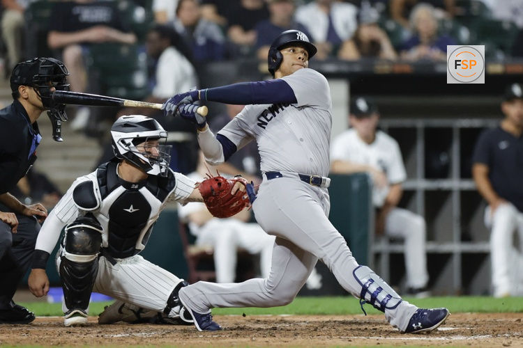 Aug 13, 2024; Chicago, Illinois, USA; New York Yankees outfielder Juan Soto (22) hits a solo home run against the Chicago White Sox during the seventh inning at Guaranteed Rate Field. Credit: Kamil Krzaczynski-USA TODAY Sports