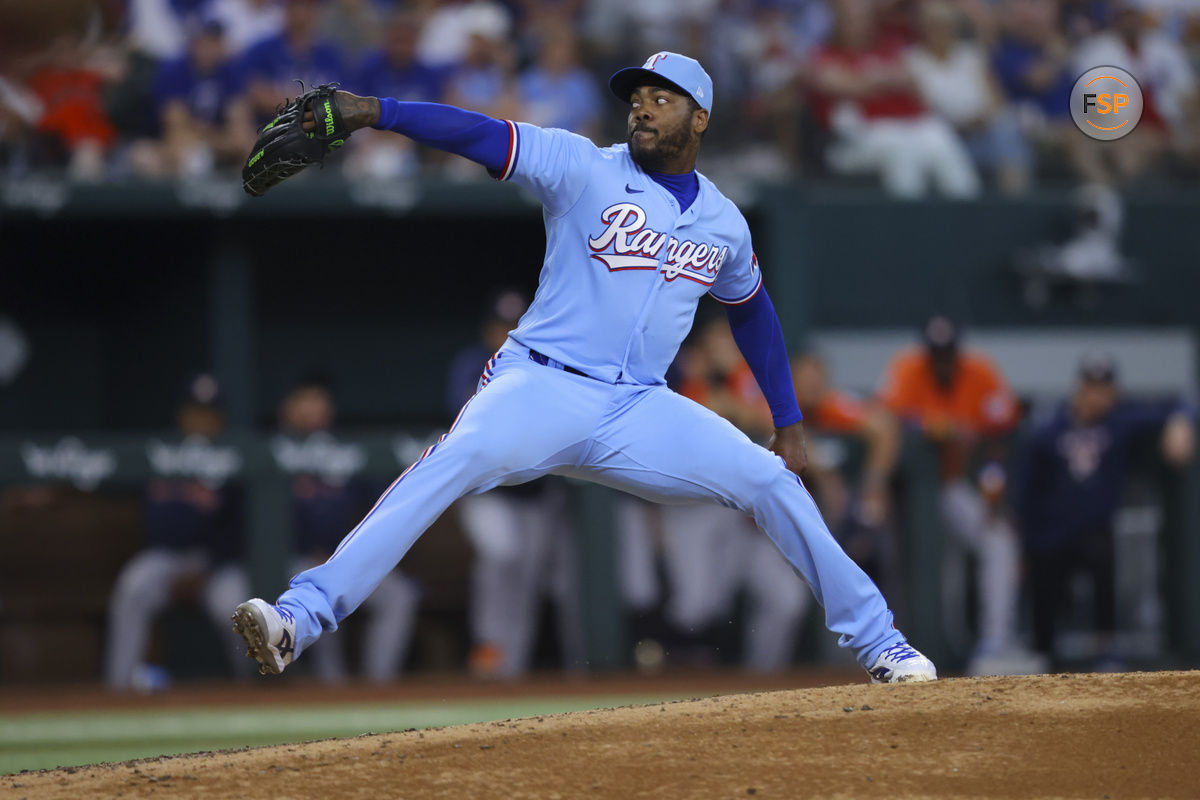 Texas Rangers relief pitcher Aroldis Chapman delivers a pitch in the seventh inning of a baseball game against the Houston Astros, Sunday, July 2, 2023, in Arlington, Texas. (AP Photo/Gareth Patterson)