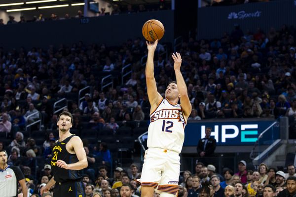Dec 20, 2025; San Francisco, California, USA; Golden State Warriors center Quinten Post (21) watches as Phoenix Suns guard Collin Gillespie (12) takes a three-point shot during the second quarter at Chase Center. Mandatory Credit: John Hefti-Imagn Images