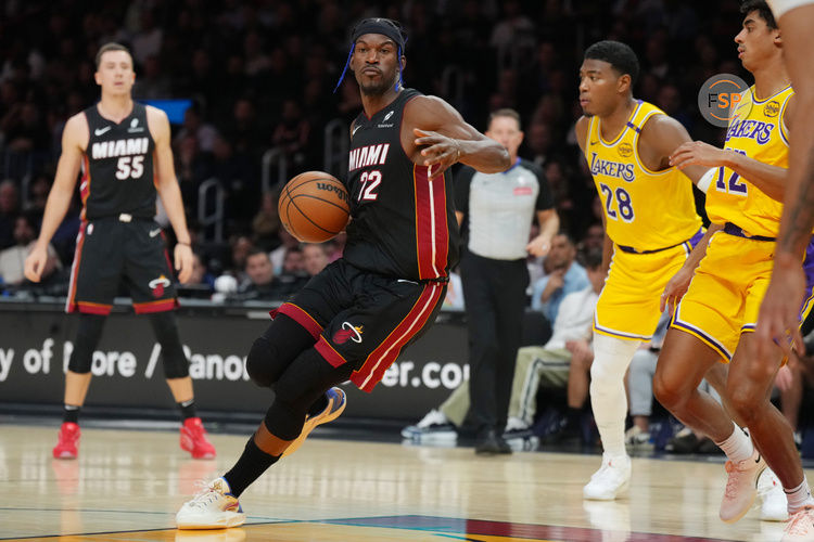 Dec 4, 2024; Miami, Florida, USA;  Miami Heat forward Jimmy Butler (22) dribbles against the Los Angeles Lakers in during the first half at Kaseya Center. Credit: Jim Rassol-Imagn Images