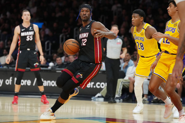 Dec 4, 2024; Miami, Florida, USA;  Miami Heat forward Jimmy Butler (22) dribbles against the Los Angeles Lakers in during the first half at Kaseya Center. Mandatory Credit: Jim Rassol-Imagn Images