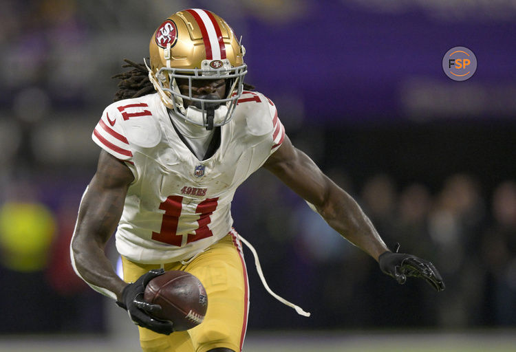 MINNEAPOLIS, MN - OCTOBER 23: San Francisco 49ers wide receiver Brandon Aiyuk (11) runs with the ball after the catch for a 6-yard gain during the first quarter of an NFL game between the Minnesota Vikings and San Francisco 49ers on October 23, 2023, at U.S. Bank Stadium in Minneapolis, MN.(Photo by Nick Wosika/Icon Sportswire)
