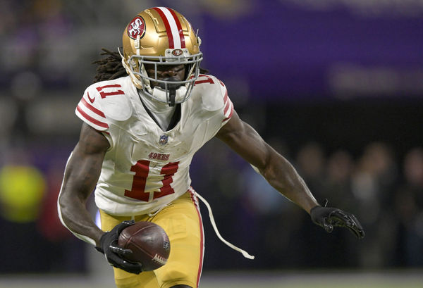 MINNEAPOLIS, MN - OCTOBER 23: San Francisco 49ers wide receiver Brandon Aiyuk (11) runs with the ball after the catch for a 6-yard gain during the first quarter of an NFL game between the Minnesota Vikings and San Francisco 49ers on October 23, 2023, at U.S. Bank Stadium in Minneapolis, MN.(Photo by Nick Wosika/Icon Sportswire)
