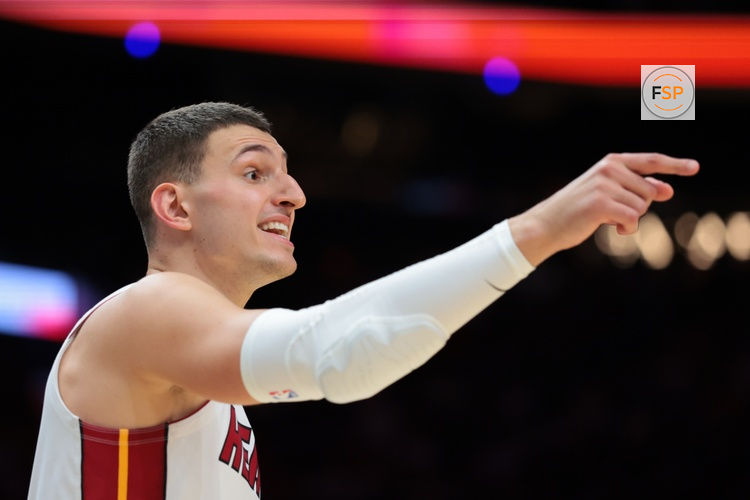 Dec 29, 2025; Miami, Florida, USA; Miami Heat forward Nikola Jovic (5) speaks to a teammate against the Denver Nuggets during the third quarter at Kaseya Center. Credit: Sam Navarro-Imagn Images