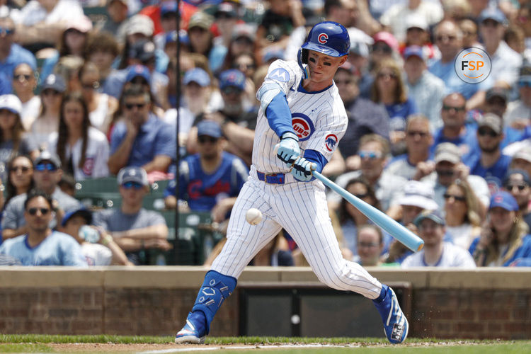 Jun 15, 2025; Chicago, Illinois, USA; Chicago Cubs center fielder Pete Crow-Armstrong (4) hits a ground out against the Pittsburgh Pirates during the first inning at Wrigley Field. Credit: Kamil Krzaczynski-Imagn Images