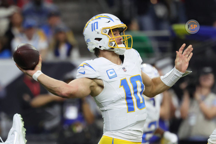 Jan 11, 2025; Houston, Texas, USA; Los Angeles Chargers quarterback Justin Herbert (10) looks to pass during the second quarter against the Houston Texans in an AFC wild card game at NRG Stadium. Credit: Troy Taormina-Imagn Images