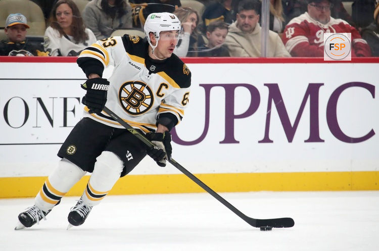 Mar 1, 2025; Pittsburgh, Pennsylvania, USA;  Boston Bruins left wing Brad Marchand (63) skates with the puck against the Pittsburgh Penguins during the first period at PPG Paints Arena. Credit: Charles LeClaire-Imagn Images