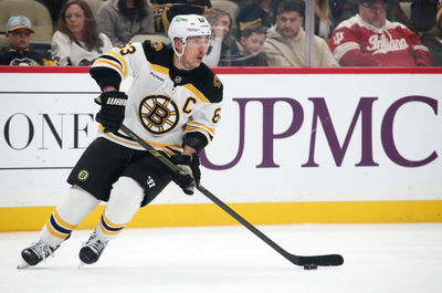 Mar 1, 2025; Pittsburgh, Pennsylvania, USA;  Boston Bruins left wing Brad Marchand (63) skates with the puck against the Pittsburgh Penguins during the first period at PPG Paints Arena. Mandatory Credit: Charles LeClaire-Imagn Images