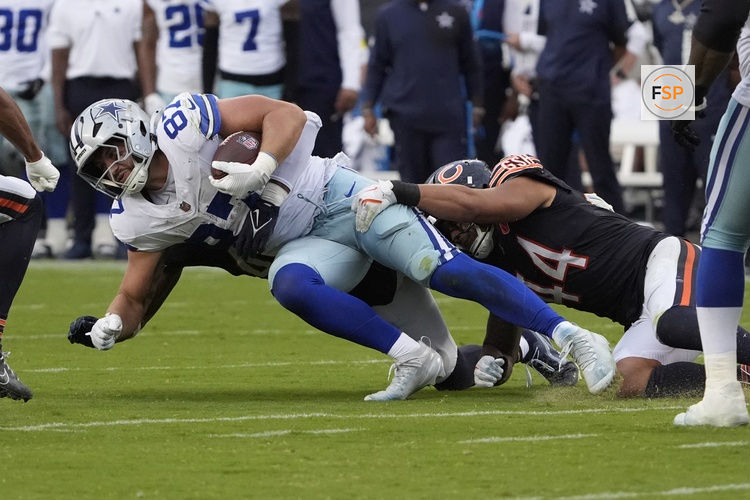 Sep 21, 2025; Chicago, Illinois, USA; Chicago Bears linebacker Noah Sewell (44) tackles Dallas Cowboys tight end Jake Ferguson (87) during the second half at Soldier Field. Credit: David Banks-Imagn Images