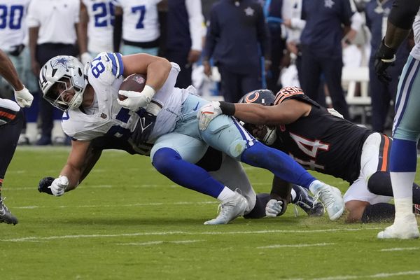 Sep 21, 2025; Chicago, Illinois, USA; Chicago Bears linebacker Noah Sewell (44) tackles Dallas Cowboys tight end Jake Ferguson (87) during the second half at Soldier Field. Mandatory Credit: David Banks-Imagn Images