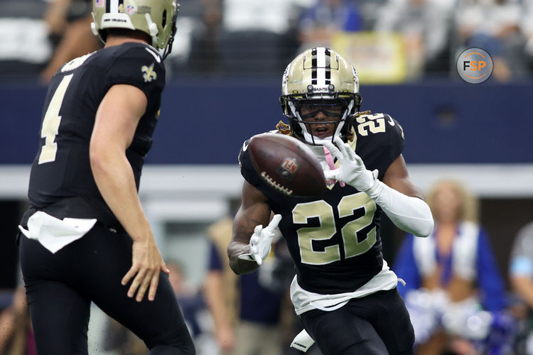 Sep 15, 2024; Arlington, Texas, USA; New Orleans Saints wide receiver Rashid Shaheed (22) takes the pitch from quarterback Derek Carr (4) in the first quarter against the Dallas Cowboys at AT&T Stadium. Credit: Tim Heitman-Imagn Images