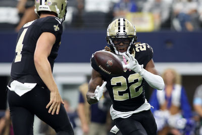 Sep 15, 2024; Arlington, Texas, USA; New Orleans Saints wide receiver Rashid Shaheed (22) takes the pitch from quarterback Derek Carr (4) in the first quarter against the Dallas Cowboys at AT&T Stadium. Mandatory Credit: Tim Heitman-Imagn Images