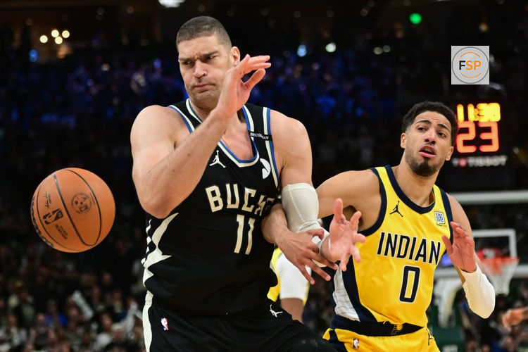 Apr 27, 2025; Milwaukee, Wisconsin, USA; Milwaukee Bucks center Brook Lopez (11) looks for a rebound against Indiana Pacers guard Tyrese Haliburton (0) in the first quarter during game four of first round for the 2024 NBA Playoffs at Fiserv Forum. Credit: Benny Sieu-Imagn Images