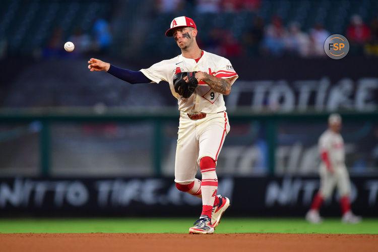 Aug 12, 2024; Anaheim, California, USA; Los Angeles Angels shortstop Zach Neto (9) throws to first for the out against Toronto Blue Jays first baseman Spencer Horwitz (48) during the fifth inning at Angel Stadium. Credit: Gary A. Vasquez-USA TODAY Sports