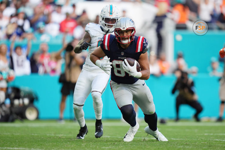 Nov 24, 2024; Miami Gardens, Florida, USA; New England Patriots tight end Austin Hooper (81) runs the ball for a touchdown against the Miami Dolphins during the second half at Hard Rock Stadium. Credit: Jasen Vinlove-Imagn Images