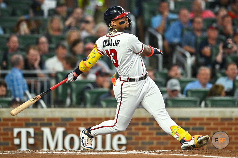 ATLANTA, GA – SEPTEMBER 18:  Atlanta right fielder Ronald Acuna Jr. (13) hits the ball deep during the MLB game between the Philadelphia Phillies and the Atlanta Braves on September 18th, 2023 at Truist Park in Atlanta, GA. (Photo by Rich von Biberstein/Icon Sportswire)