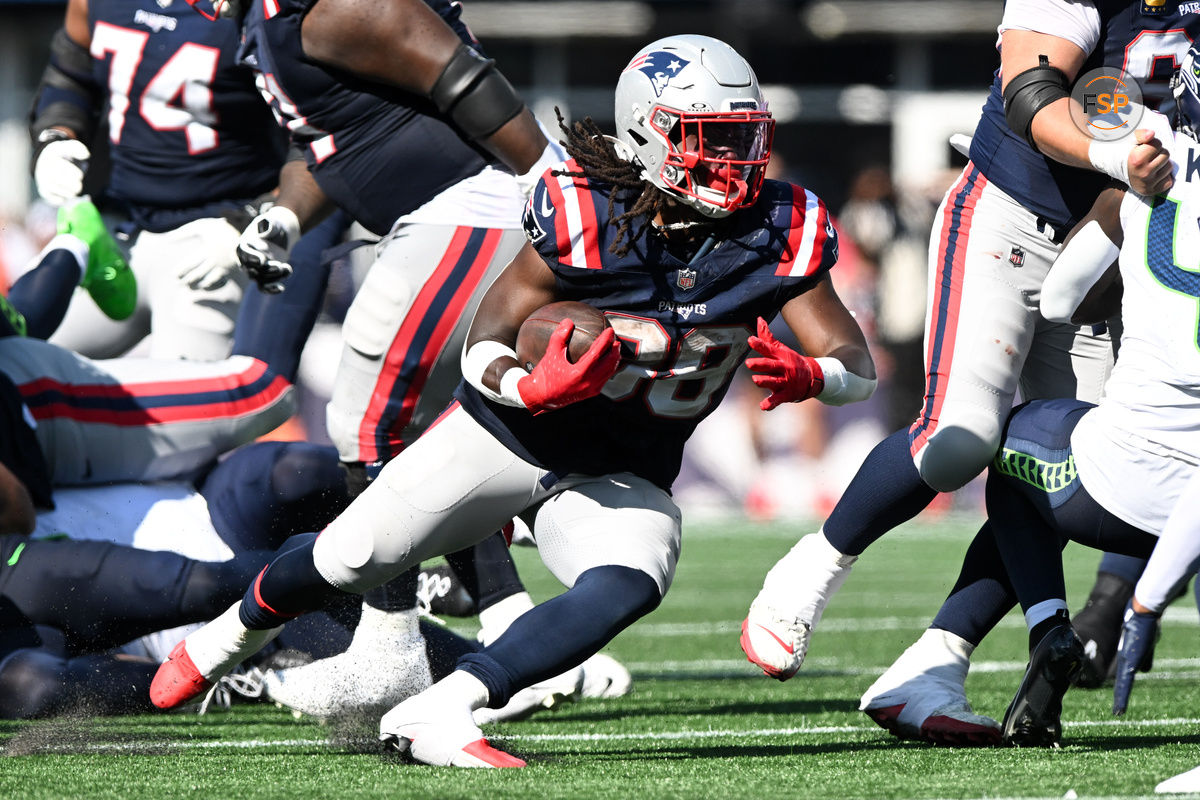 Sep 15, 2024; Foxborough, Massachusetts, USA;  New England Patriots running back Rhamondre Stevenson (38) runs with the ball against the Seattle Seahawks during the second half at Gillette Stadium. Credit: Brian Fluharty-Imagn Images