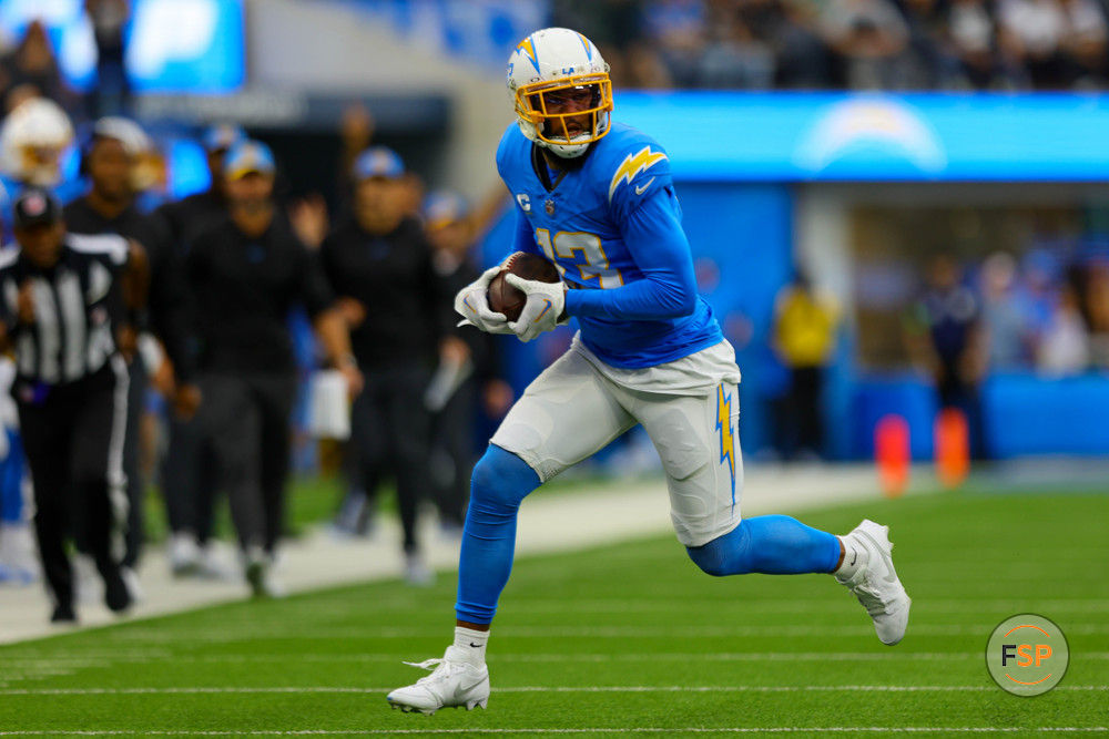 INGLEWOOD, CA - OCTOBER 1: Los Angeles Chargers wide receiver Keenan Allen (13) catches the ball for a gain during the NFL regular season game between the Las Vegas Raiders and the Los Angeles Chargers on October 1, 2023, at SoFi Stadium in Inglewood, CA. (Photo by Jordon Kelly/Icon Sportswire)