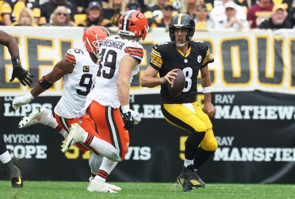 Oct 12, 2025; Pittsburgh, Pennsylvania, USA;  Cleveland Browns defensive end Myles Garrett (95) and linebacker Carson Schwesinger (49) chase Pittsburgh Steelers quarterback Aaron Rodgers (8) during the second quarter at Acrisure Stadium. Mandatory Credit: Charles LeClaire-Imagn Images