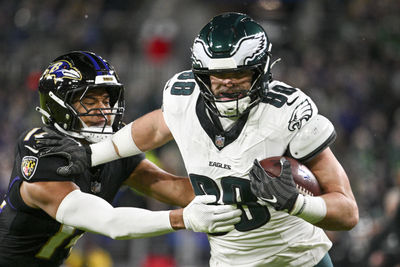 Dec 1, 2024; Baltimore, Maryland, USA; Philadelphia Eagles tight end Dallas Goedert (88) runs through Baltimore Ravens safety Kyle Hamilton (14) tackles attempt for a touchdown  during the first half  at M&T Bank Stadium. Mandatory Credit: Tommy Gilligan-Imagn Images