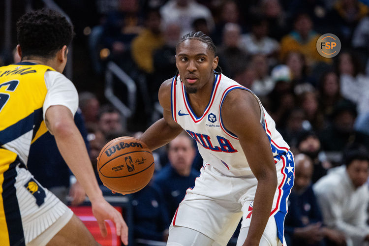 Jan 18, 2025; Indianapolis, Indiana, USA; Philadelphia 76ers guard Tyrese Maxey (0) dribbles the ball while  Indiana Pacers guard Ben Sheppard (26) defends in the second half at Gainbridge Fieldhouse. Credit: Trevor Ruszkowski-Imagn Images