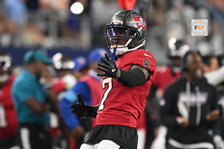 Oct 8, 2026; Arlington, Texas, USA;  Tampa Bay Buccaneers running back Bucky Irving (7) reacts after rushing the ball against Dallas Cowboys linebacker Donovan Ezeiruaku (6) at AT&T Stadium.  Credit: Jerome Miron-Imagn Images