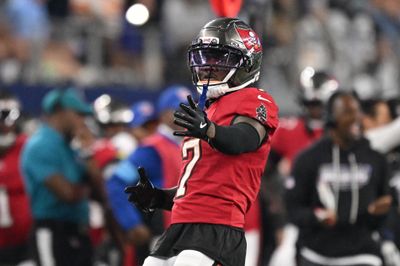 Oct 8, 2026; Arlington, Texas, USA;  Tampa Bay Buccaneers running back Bucky Irving (7) reacts after rushing the ball against Dallas Cowboys linebacker Donovan Ezeiruaku (6) at AT&T Stadium.  Mandatory Credit: Jerome Miron-Imagn Images