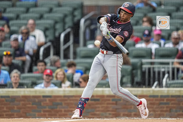 May 23, 2026; Cumberland, Georgia, USA; Washington Nationals left fielder Daylen Lile (4) hits a triple against the Atlanta Braves during the second inning at Truist Park. Credit: Dale Zanine-Imagn Images