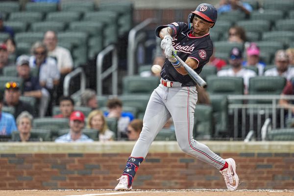 May 23, 2026; Cumberland, Georgia, USA; Washington Nationals left fielder Daylen Lile (4) hits a triple against the Atlanta Braves during the second inning at Truist Park. Mandatory Credit: Dale Zanine-Imagn Images