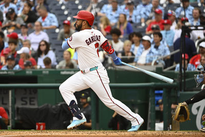 Jun 15, 2025; Washington, District of Columbia, USA; Washington Nationals second baseman Luis Garcia Jr. (2) singles against the Miami Marlins during the fifth inning at Nationals Park. Mandatory Credit: Brad Mills-Imagn Images